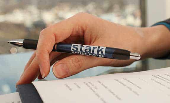 Stark Office Suites logo on a pen