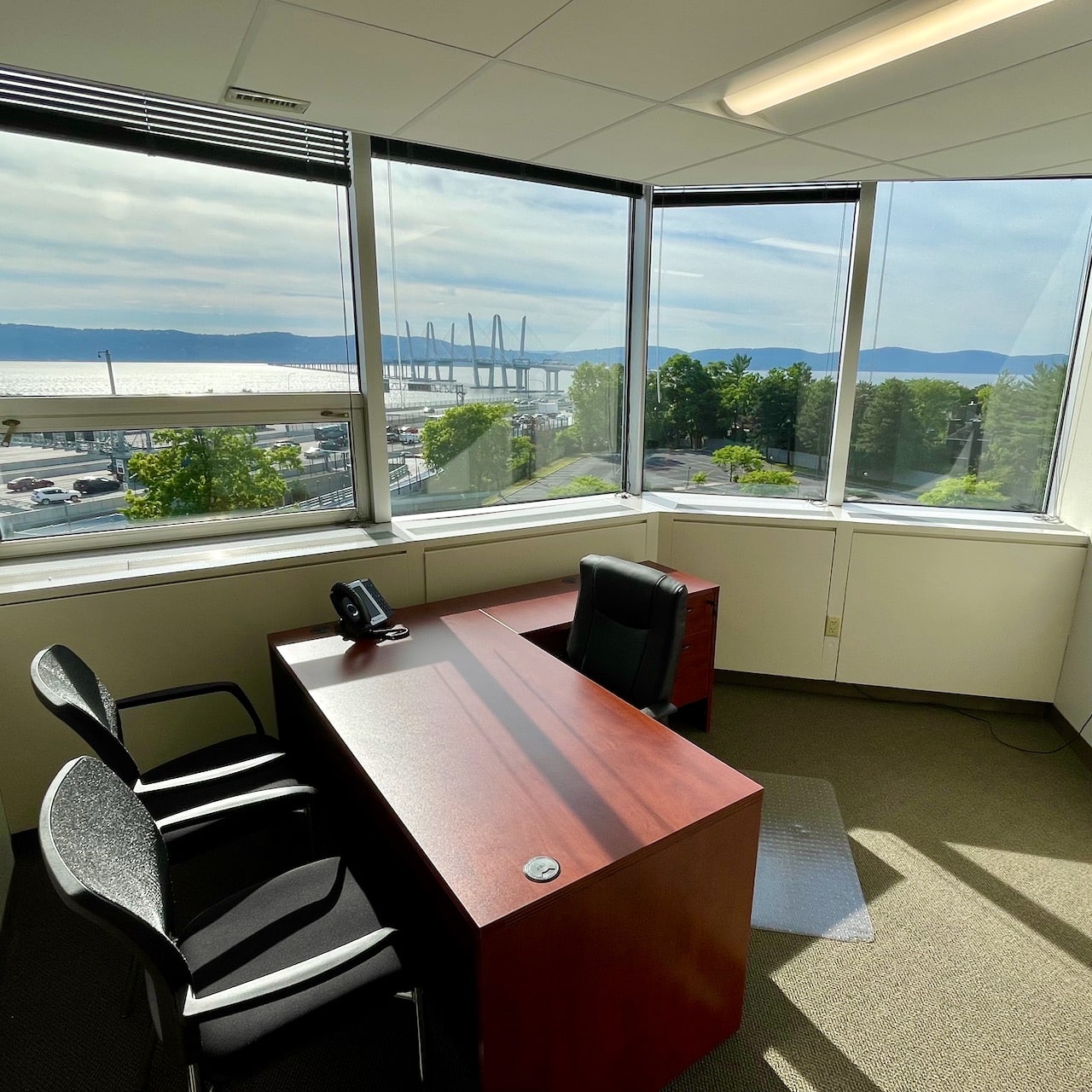 office with desk & chairs with view of Tappan Zee Bridge