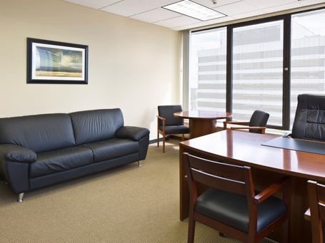 office with desk and chairs and couch